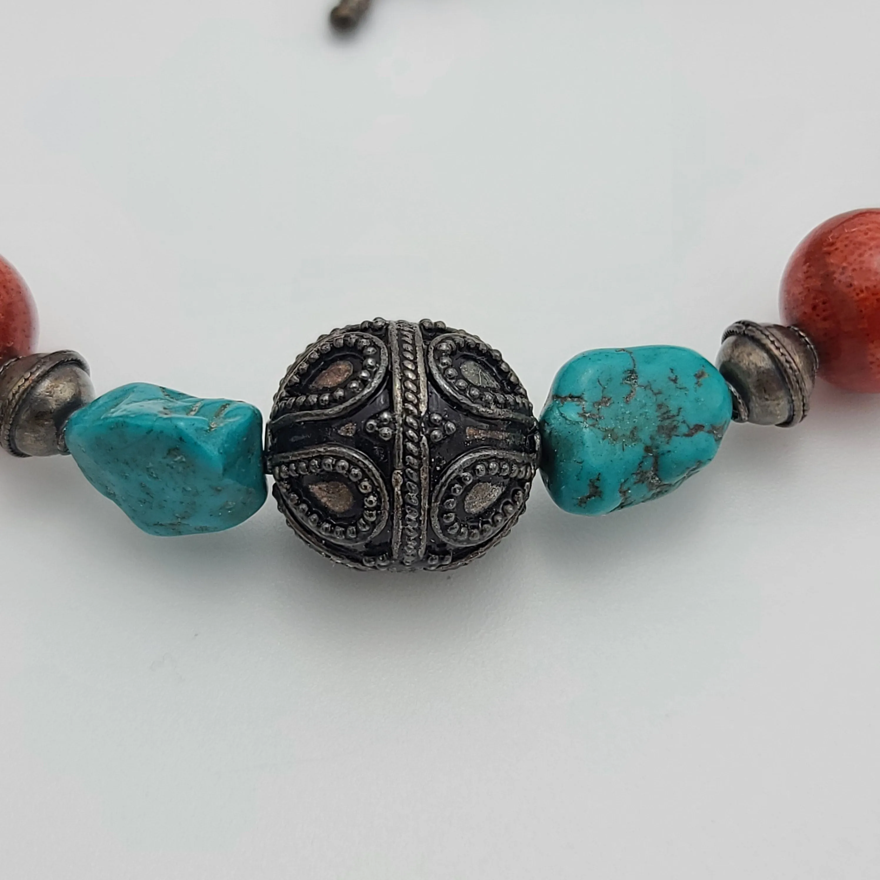 Stylish Beaded Necklace with Turquoise, Coral, and Antique Sterling Silver Beads.