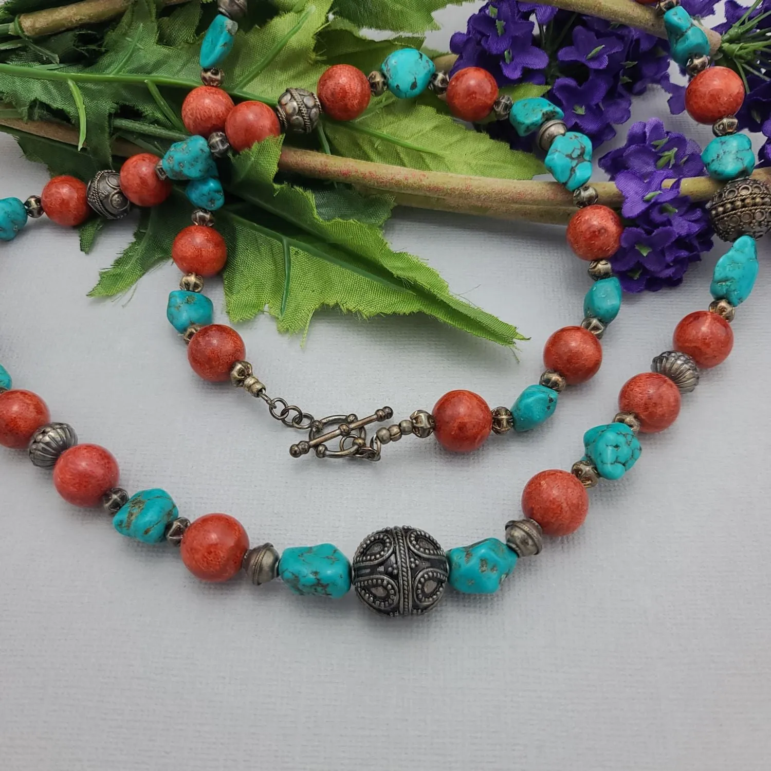 Stylish Beaded Necklace with Turquoise, Coral, and Antique Sterling Silver Beads.