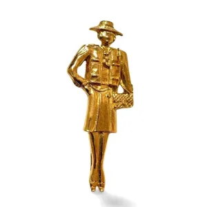 Vintage CHANEL Gold tone brooch in Chanel mademoiselle figure. Classic pin brooch. 040104m1